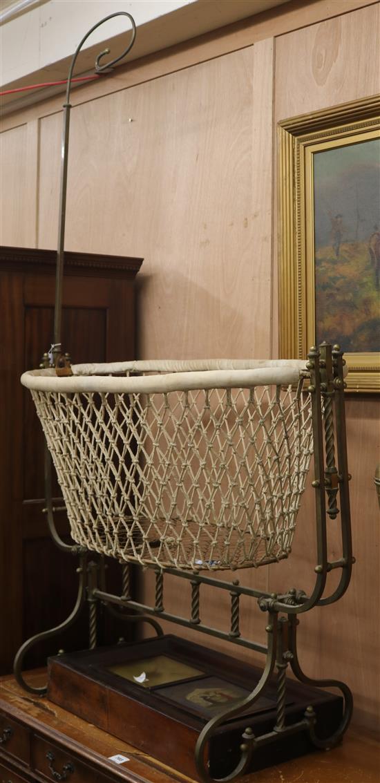 An Edwardian brass framed cradle W.110cm